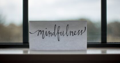 Card with the word Mindfulness, sitting on a windowsill
