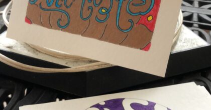 greeting cards that say namaste and life is good on a table