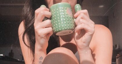 woman enjoying GREENY-GREEN ALOE VERA DETOX SMOOTHIE