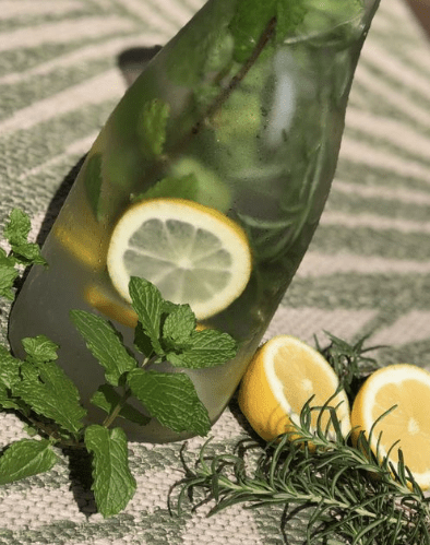 bottle of water with sliced lemons