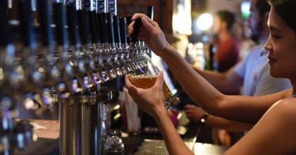 bartender pouring a draft beer
