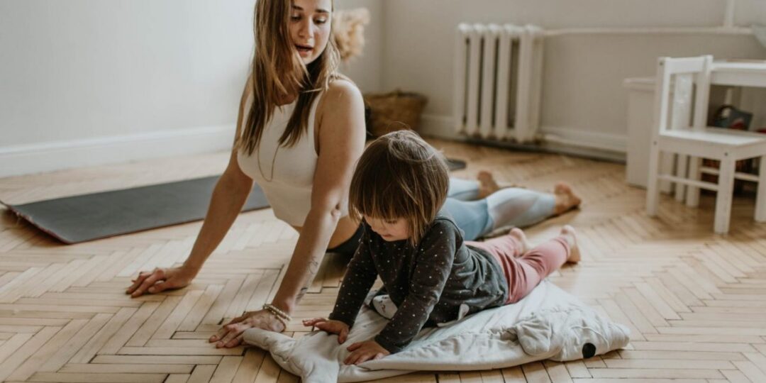mom doing yoga with child